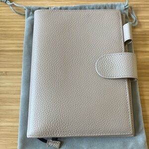 Moterm taupe pebble leather b6 cover w/back pocket 
Dust bag included
